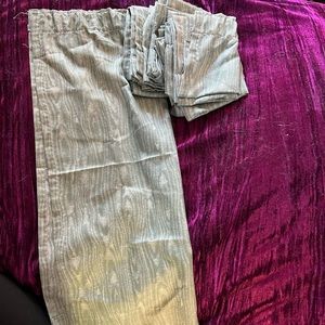 Eight semi sheer green and white rod pocket curtains